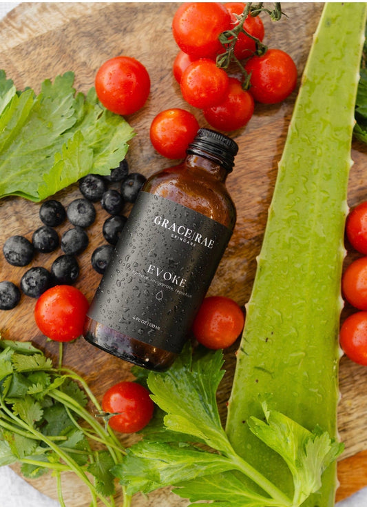 photo of Grace | Rae Skincare Evoke Essence with fruit flatlay